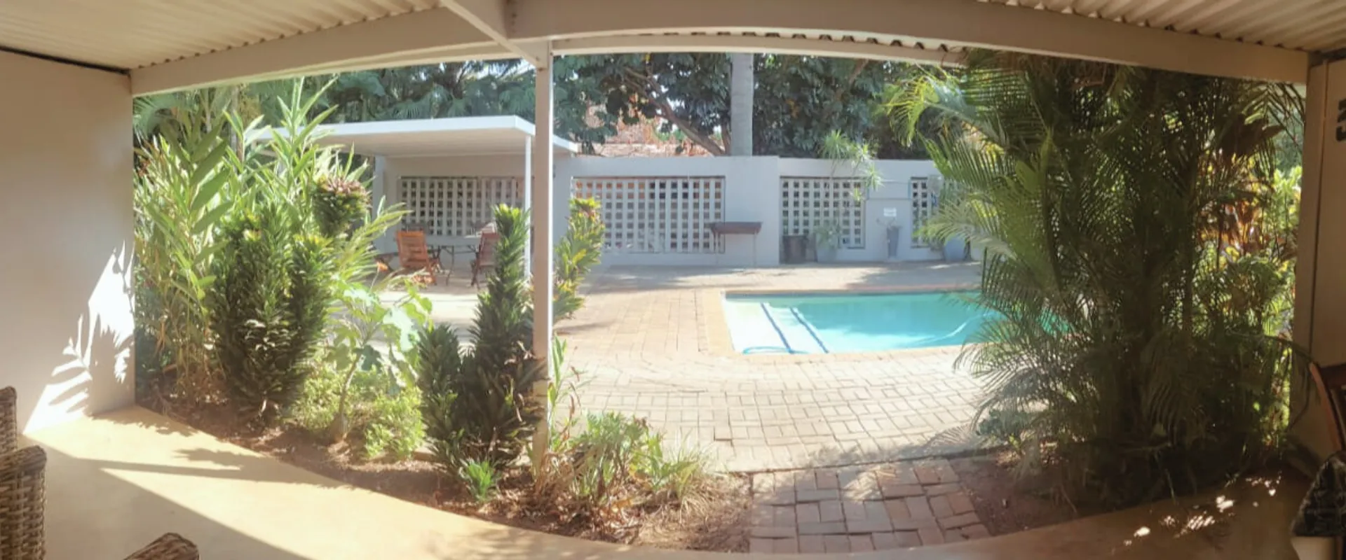 The Wilds Guest House patio and pool view in Hluhluwe